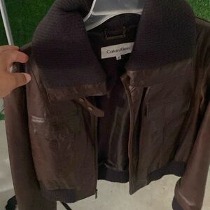 Brown leather jacket with high collar